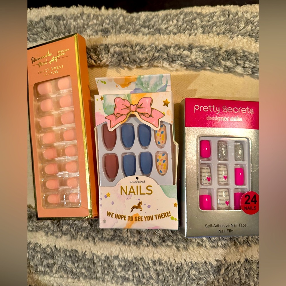 3 sets of self press- on nails (misc sized)